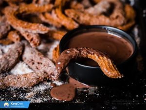 Churros With Powdered Sugar and Chocolate Jam
